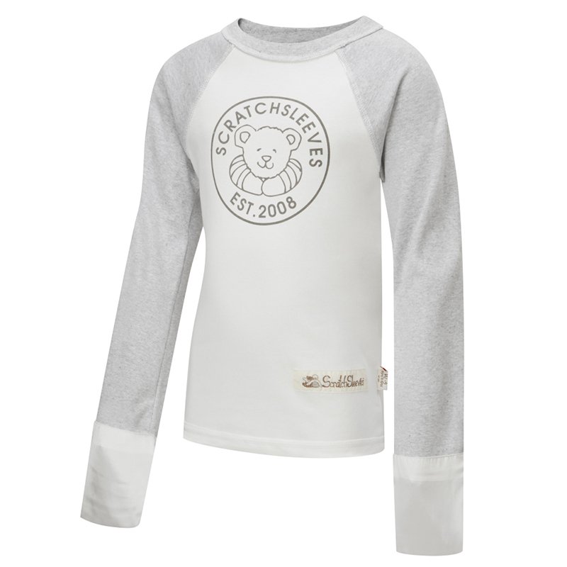 Front view of children's baseball style flip-mitt ScratchSleeves pyjama top with external shoulder, neck and hem seams. White body with grey screen printed logo featuring a bear and est.2008. Grey marl neck and sleeves, with white mitts folded down to cover hands. 100% cotton body and 100% natural silk mitts. External label and branding on the left side towards the base of the top.