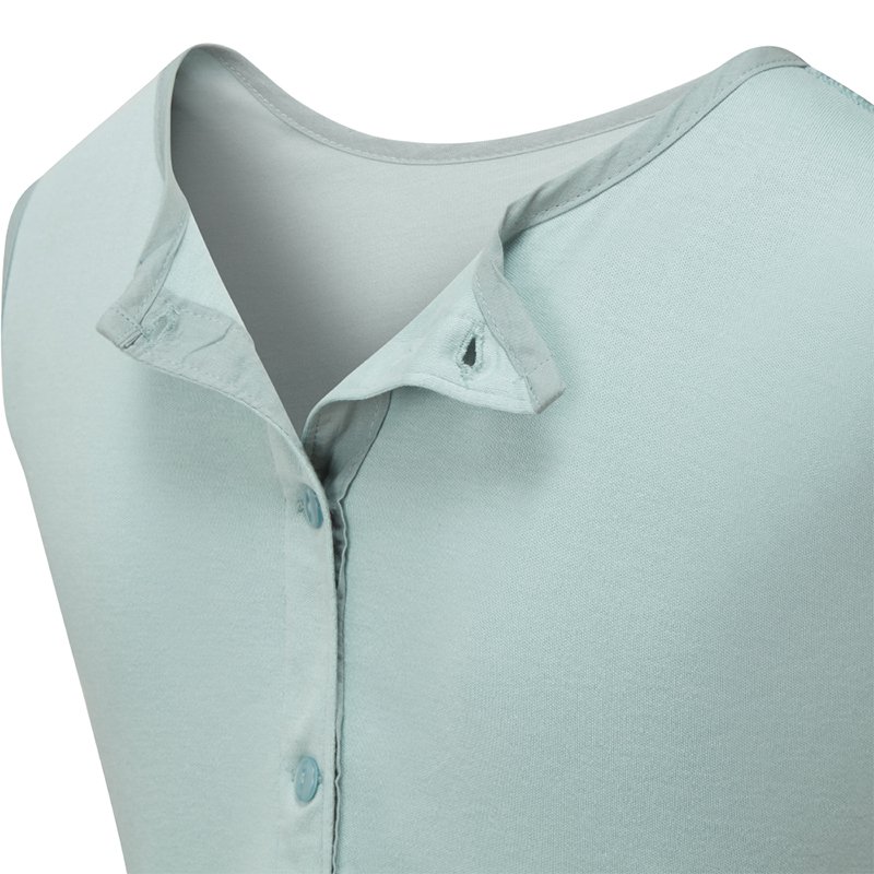 Close up view of the back of ScratchSleeves children's dungarees, shows the reinforced opening at the back, from the neck down, partially open with green buttons on the right and holes and a loops for the buttons on the left. Additional tab on the right with button hole which folds over the neckline with button fastening to keep it secure. Seafoam Green sleeveless body in 100% cotton jersey with grey woven cotton trim on the neck.