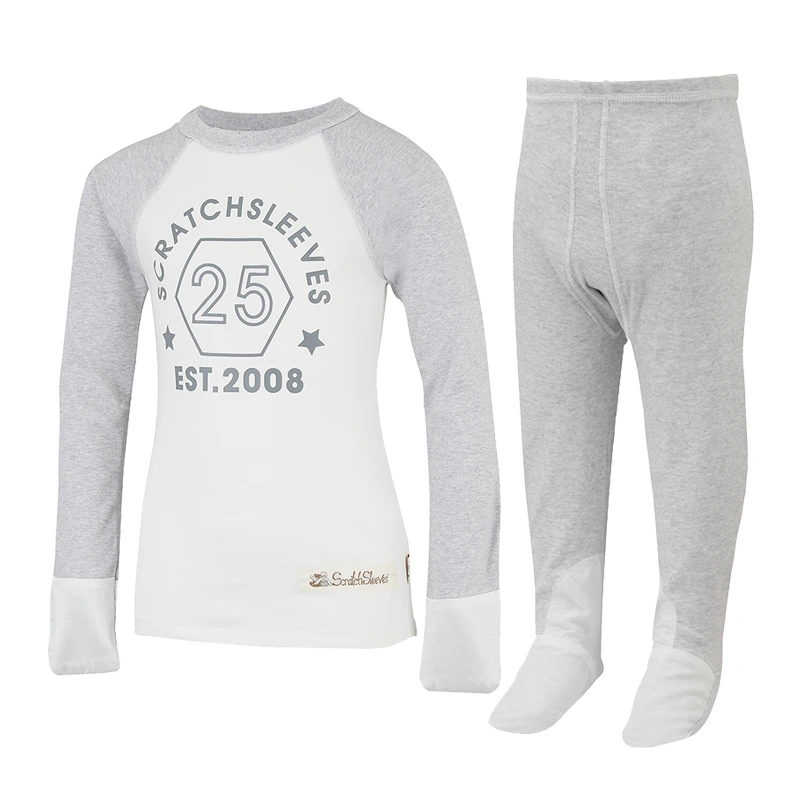 Front view of baseball style ScratchSleeves pyjama top with external shoulder, neck and hem seams. White body with grey printed logo featuring a hexagon and est.2008. Grey marl neck and sleeves, with white sewn in mitts. 100% cotton body and 100% natural silk mitts. External label and branding on the left side towards the base of the top. Front view of ScratchSleeves grey marl pyjama bottoms with no inside leg seam and sewn in feet. Closed feet with a layer of white, 100% woven cotton over the front of the foot and under the toe. 100% cotton jersey.